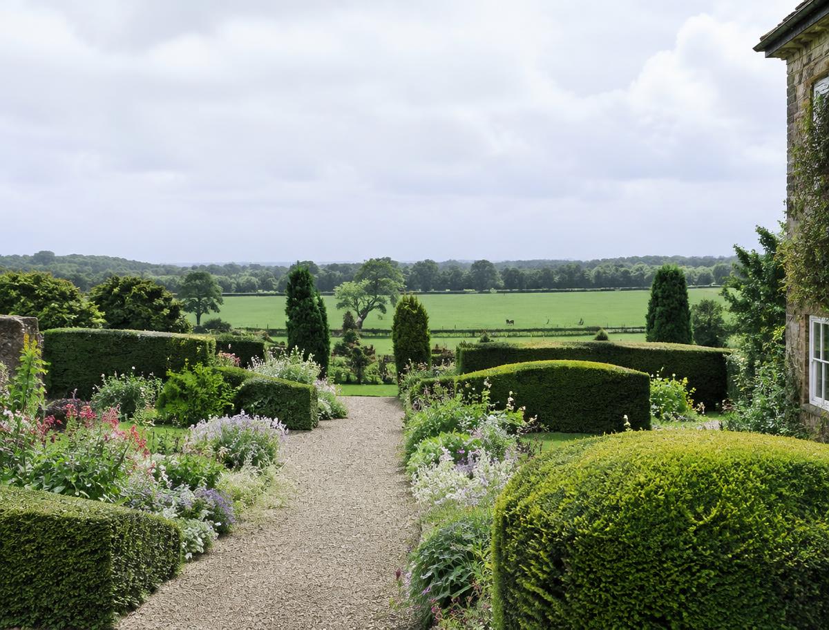 Kildare country garden with clipped hedges and a gravel path